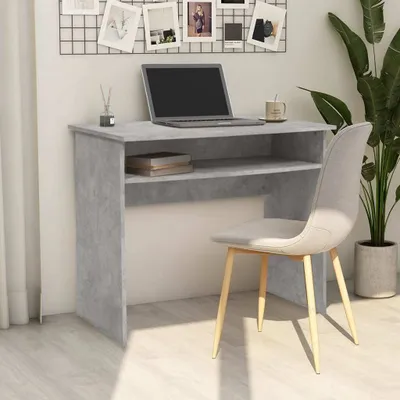 A desk and chair in a room setting.