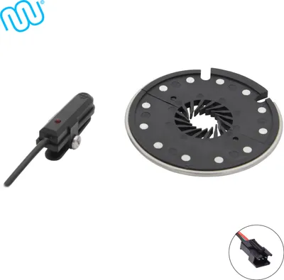 A close-up product shot of e-bike pedal assist sensor and a magnet disc.