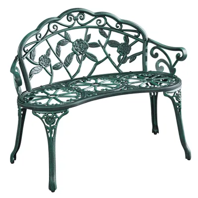 A green metal garden bench with a rose pattern.