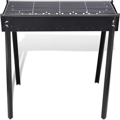 A black metal BBQ grill with a grate on top and four legs, shown from the front on a white background.