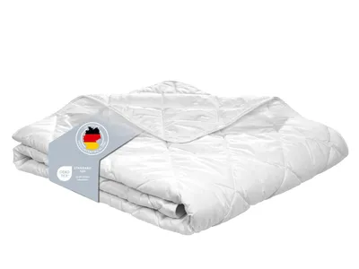 A folded white duvet is presented on a white background with a product tag attached.