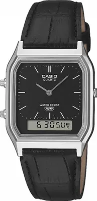 A close-up studio shot of a Casio watch with a black leather strap and a black dial.