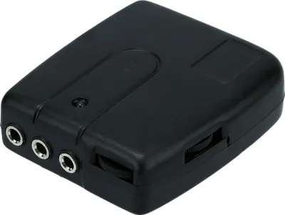A black electronic device with multiple ports and a dial.