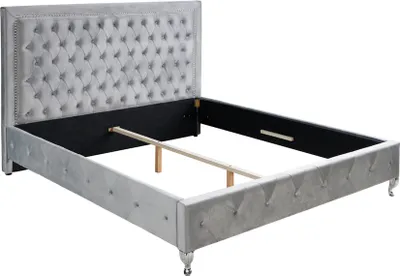 A silver-grey velvet Chesterfield bed frame with tufted headboard and footboard, shown without a mattress.