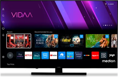 A smart TV screen displaying a user interface with various app icons and recommended content.