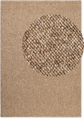 A close-up view of a textured rug with a circular inset showing a more detailed view of the weave.
