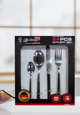 A box of cutlery set displayed on a white surface.