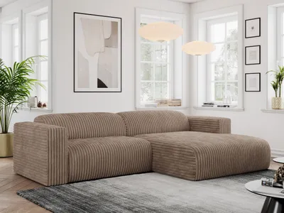 A modern living room with a large sectional sofa.