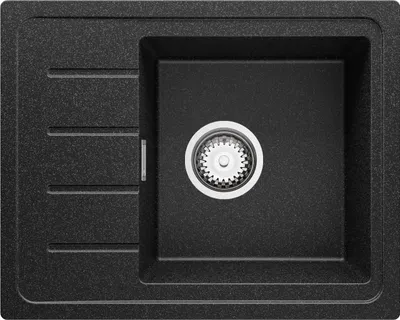 A top-down view of a black granite kitchen sink with a single basin and a drain.