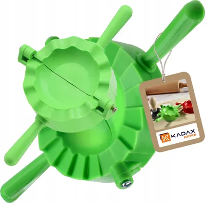 A green dumpling maker is shown against a white background, with a product tag attached.