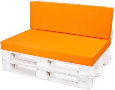 A white pallet sofa with orange seat and back cushions.