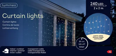 A product image showing curtain lights on a window at dusk.
