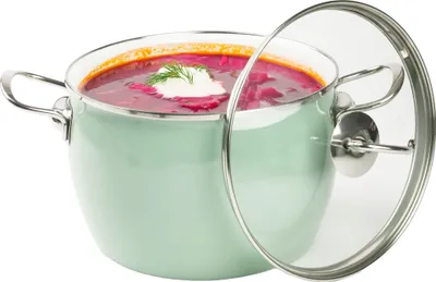 A pot of borscht soup with a dollop of sour cream and dill, with the glass lid propped open.