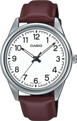 A close-up studio shot of a Casio watch with a white face and a brown leather strap.