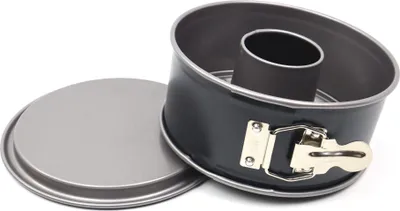 A springform pan with a removable bottom and a central tube, shown with its flat base next to it.