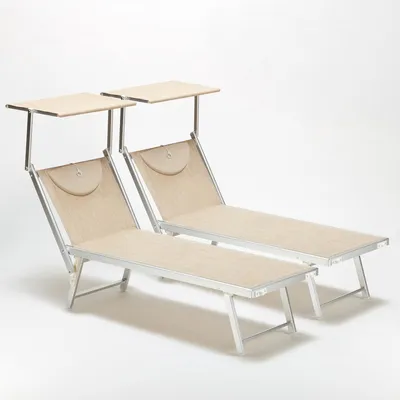 Two beach chairs with sunshades against a white background.