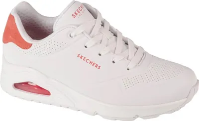 A white Skechers sneaker with red accents.