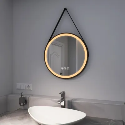 A bathroom sink with a mirror above it.