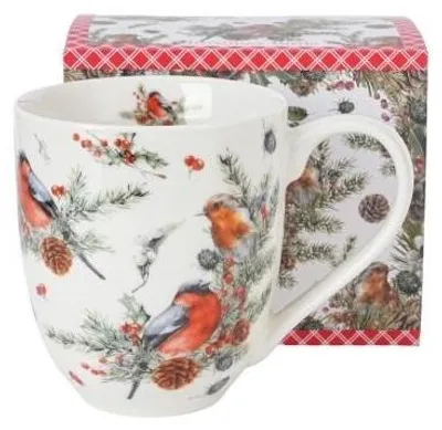 A close-up view of a large Christmas mug with a festive bird and pine branch design, placed next to its packaging.