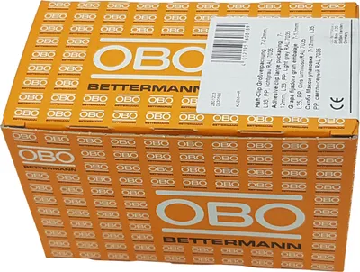 A cardboard box with the brand name 'OBO BETTERMANN' printed repeatedly on its sides. A label with product information and a barcode is attached to the top right corner.