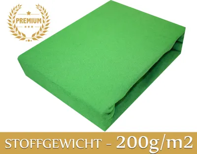 A green fitted sheet is shown on a white background, with a premium badge and text indicating fabric weight.