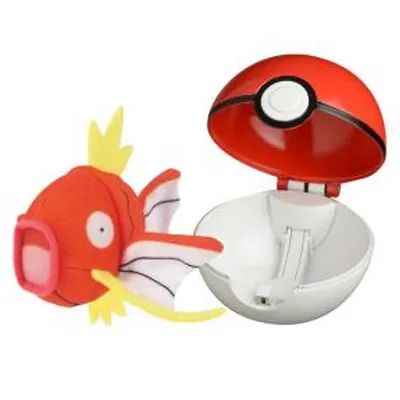 A plush toy Magikarp and an open Pokeball are displayed against a white background.