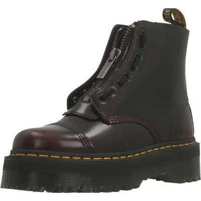 A single burgundy Dr. Martens boot with a platform sole and a zipper closure.