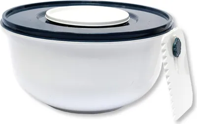 A white mixing bowl with a dark blue lid and a white insert is shown against a white background. A white handle with a serrated edge is attached to the side of the bowl.