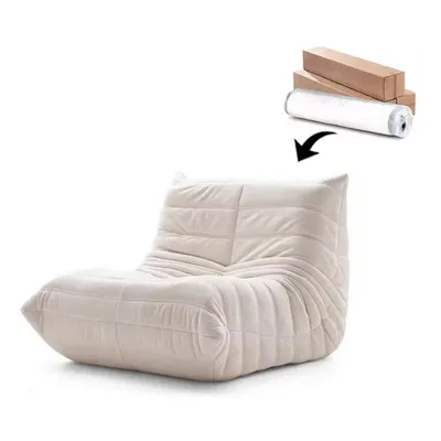 A beige beanbag chair is shown on a white background, with a rolled-up item and boxes in the upper right corner, and an arrow pointing from the rolled-up item to the chair.