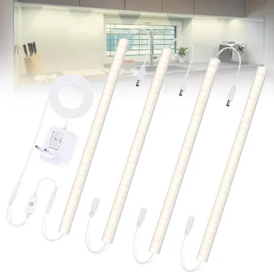 A set of LED light strips and accessories laid out on a white background, with a blurred kitchen scene in the background.
