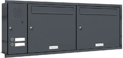 A dark gray, modern mailbox unit with two mail slots and two doors, mounted on a wall.