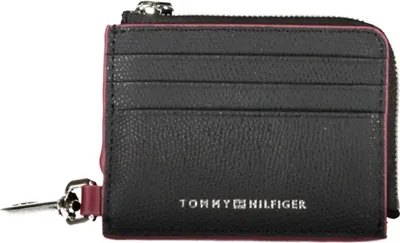 A black Tommy Hilfiger wallet with pink trim and card slots.
