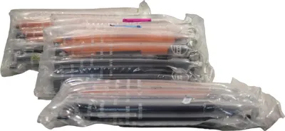 Several packages of toner cartridges are stacked and arranged diagonally.