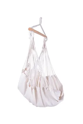 A white fabric hammock chair with a wooden spreader bar hangs against a white background.