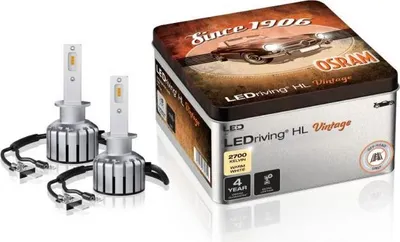 A product shot of two LED headlight bulbs and their packaging.