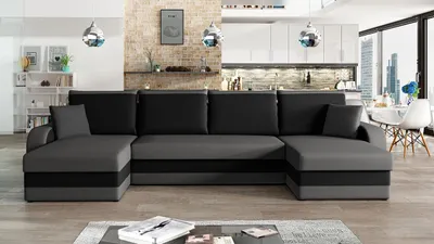 A U-shaped sectional sofa is shown in a modern living room setting with a kitchen area in the background.