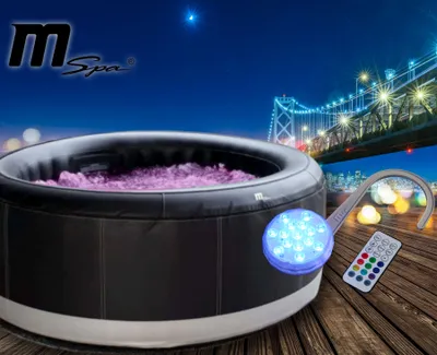 An inflatable hot tub is shown at night with a bridge and city lights in the background. A remote control and LED light accessory are also visible.