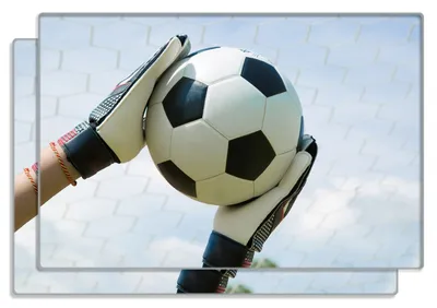 Produktbild von Wallario Frühstücksbrettchen 2er Set aus Glas, je 20 x 30 cm, mit rutschfesten Füßen, Motiv Fußball - Torwart im Tor vor blauem Himmel