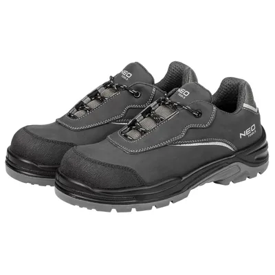 A pair of dark gray work shoes are shown against a white background.