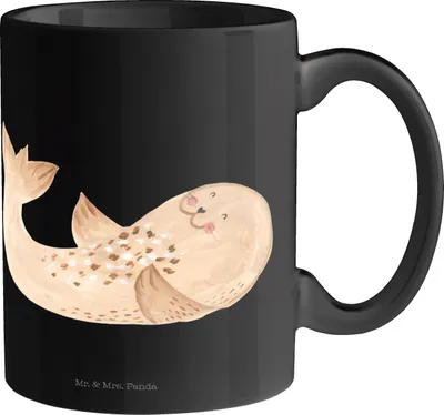 Produktbild von Mr. & Mrs. Panda Teetasse Robbe Liegen - Schwarz - Geschenk, Meerestier, Ostsee, Lustige Sprüche, Nordsee, Strand, Pott, Seehund, Kaffeetasse, Keramiktasse, Tasse