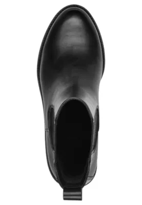 A top-down view of a black Chelsea boot.