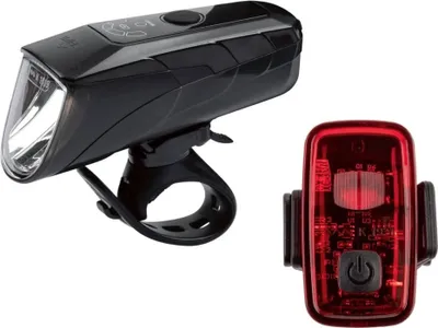 A black bicycle headlight and a red bicycle taillight are shown against a white background.