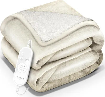 A folded beige electric blanket with a white controller attached.
