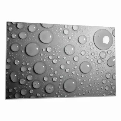 Produktbild von Wallario Herdabdeckplatte aus Glas, Größe 80 x 52 cm 2-teilig, Motiv Wassertropfen in schwarz weiß