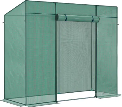 A green greenhouse with a roll-up door.