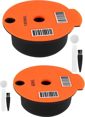Two reusable coffee filter capsules with accessories.