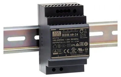A black power supply unit is mounted on a silver DIN rail.