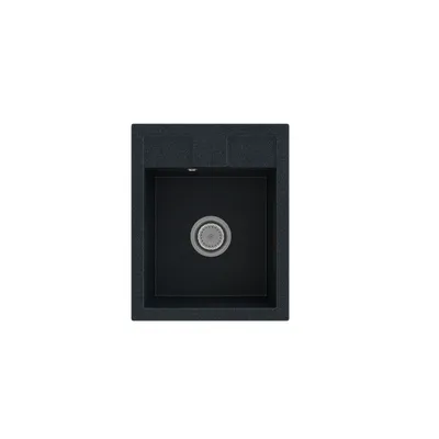 A top-down view of a black granite kitchen sink with a silver drain.