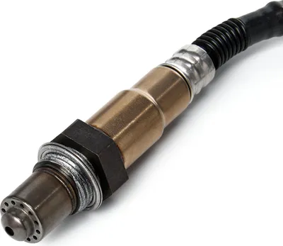 A close-up studio shot of an oxygen sensor, a car part.