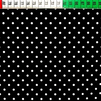 Produktbild von Baumwolle 100% Punkte 4mm weiß auf schwarzem Hintergrund